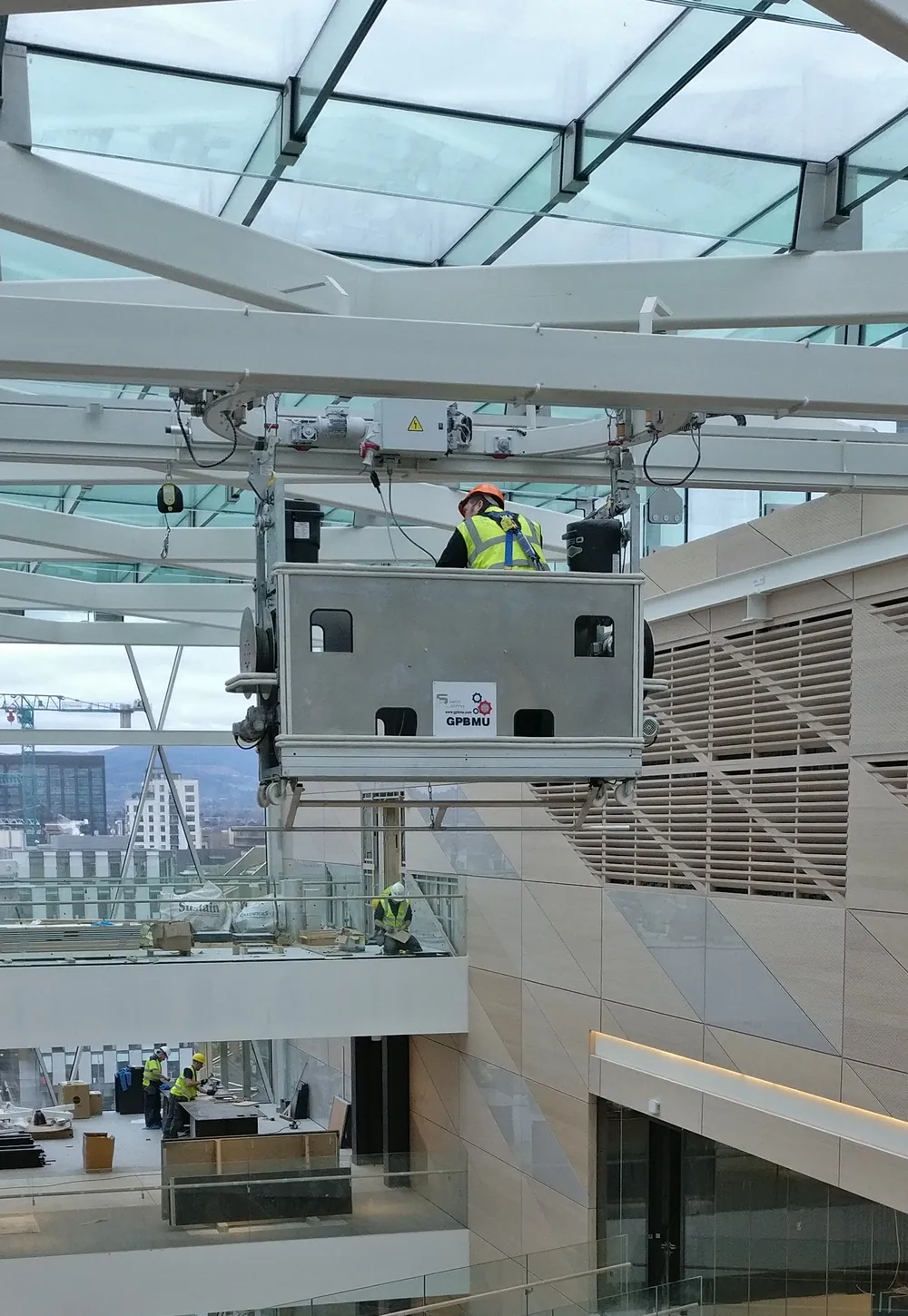 GPBMU cradle on an interior monorail under a glass atrium roof