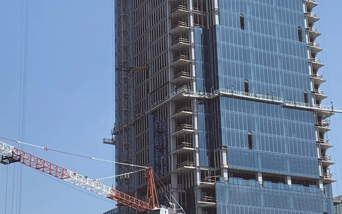 Rigid suspended platforms powered by LTD-P hoists on a high-rise under construction